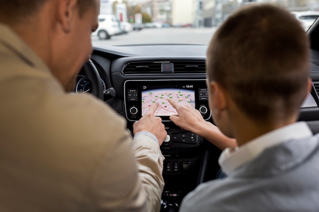 Boy and dad near an electric car