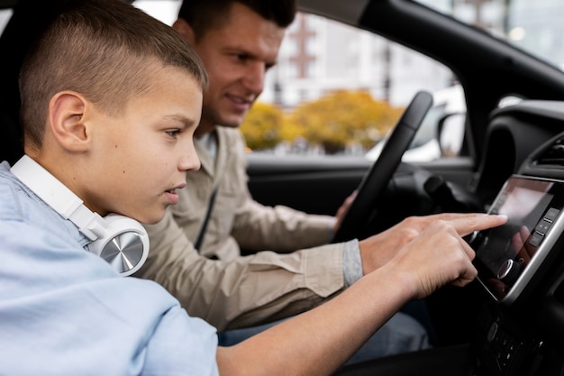 Boy and dad near an electric car