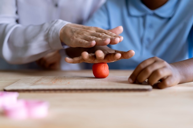 Boy doing a occupational therapy session with a psychologist