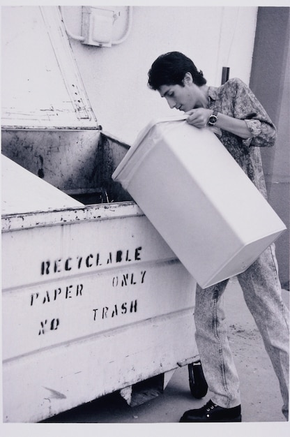 Free photo boy fills recycle bin