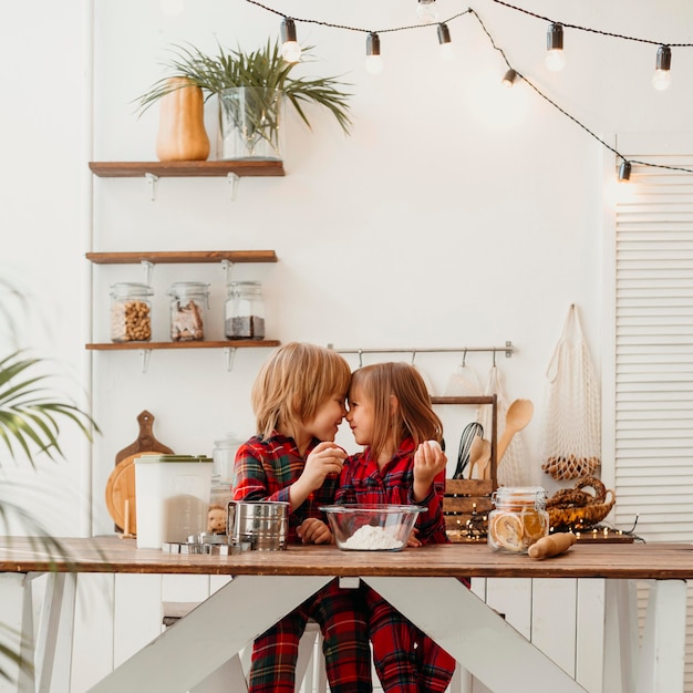 Free photo boy and girl cooking together at home