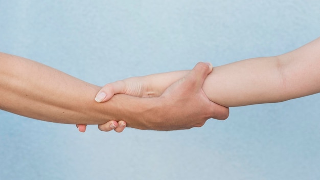 Boy and girl holding their arms