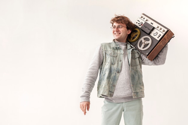 Boy holding cassette with copy-space