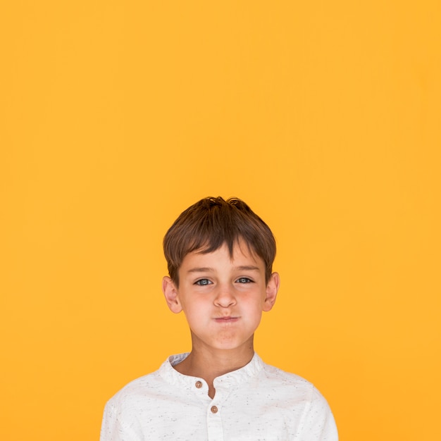 Free Photo boy holding his breath with copy space