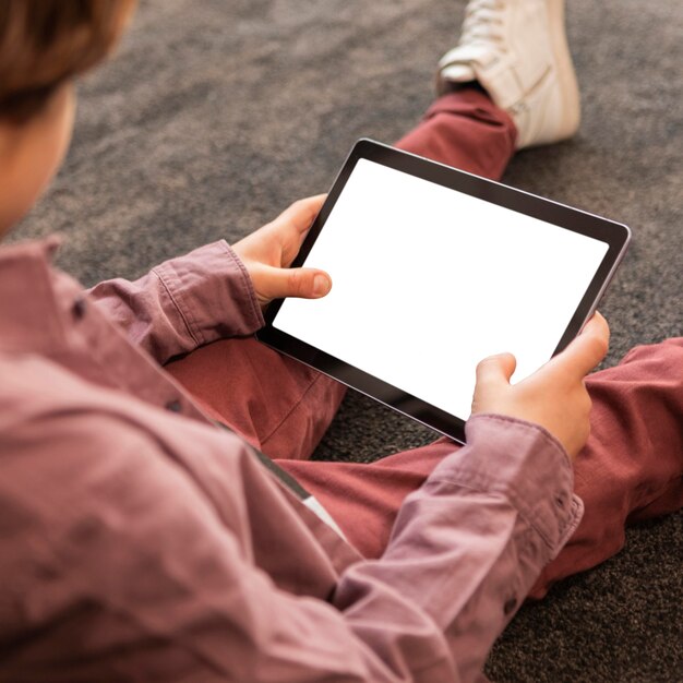 Boy at home with tablet