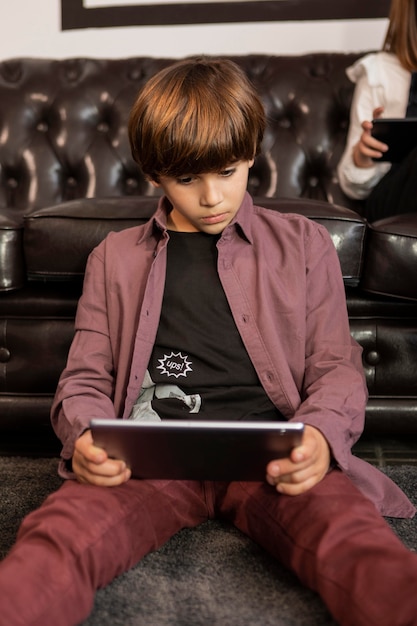 Boy at home with tablet