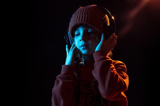 Boy listening to music and dancing