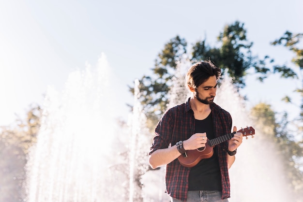 Boy playing the ukelele