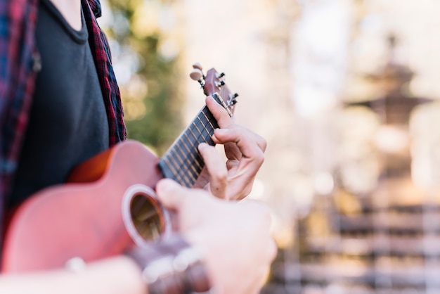 Free photo boy playing the ukelele