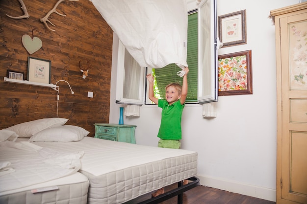 Boy playing with sheet