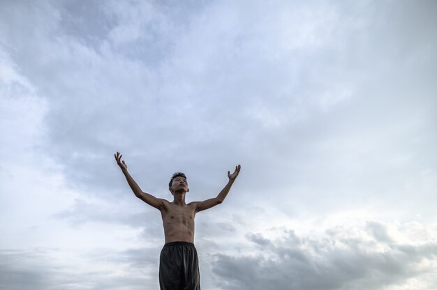 The boy raised his hand to the sky to ask for rain, Global warming and water crisis