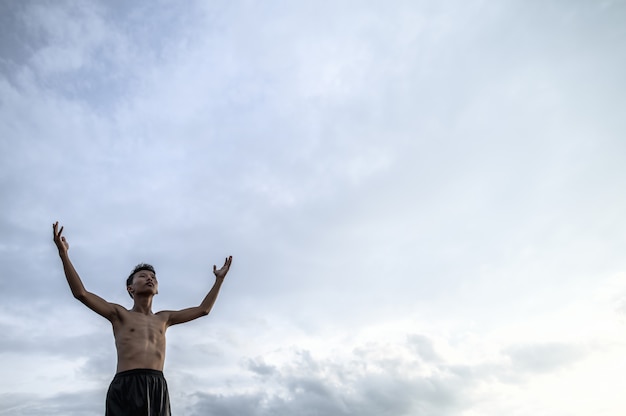 The boy raised his hand to the sky to ask for rain, Global warming and water crisis