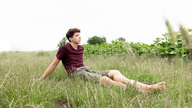 Boy relaxing and ejoying nature