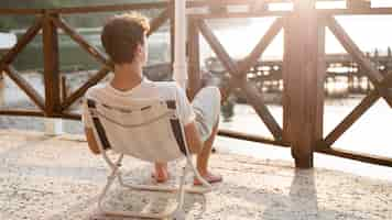 Free photo boy relaxing and spending time in nature