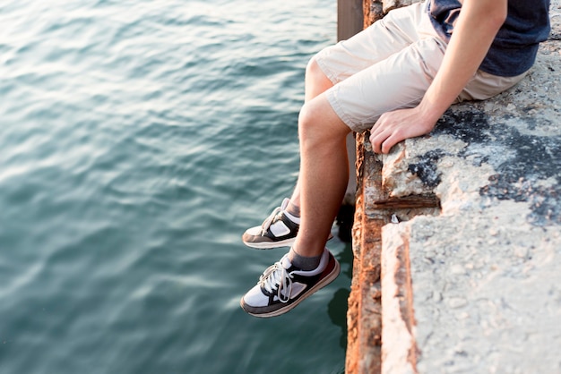 Free photo boy relaxing and spending time at sea