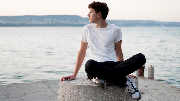 Boy relaxing and spending time at sea