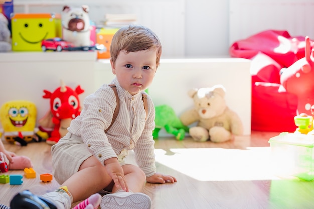 Boy sitting in playroom