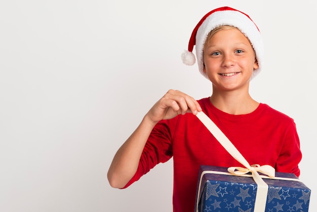 Boy unwrapping christmas presents