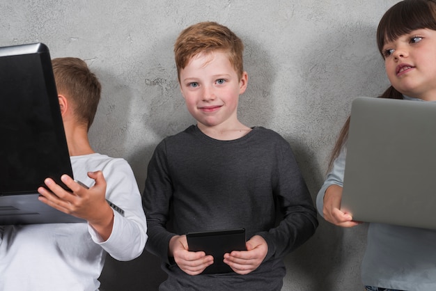 Boy using electronic devices