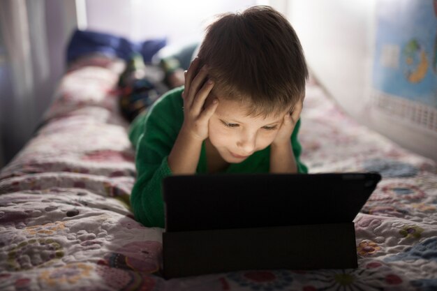 Boy watching movie on tablet