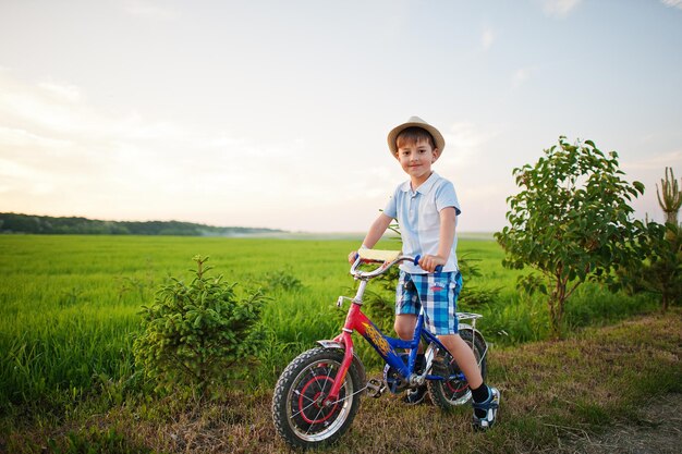 Boy wear hat in bicycle happy children moments