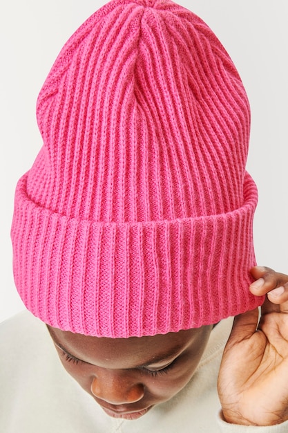 Free Photo boy wearing pink beanie 