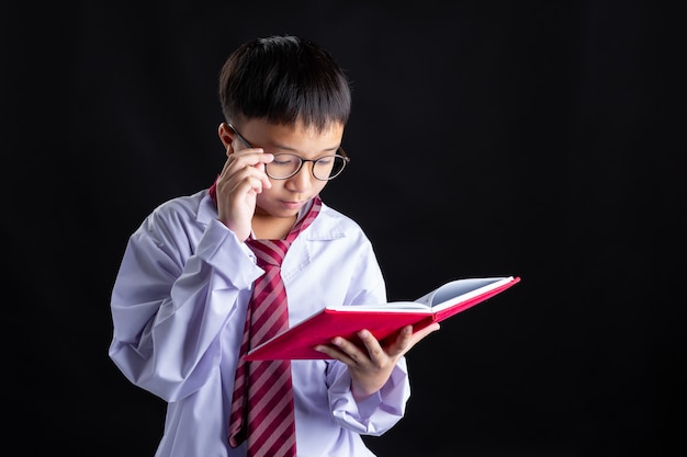 Boy with Costume imitate adults is reading