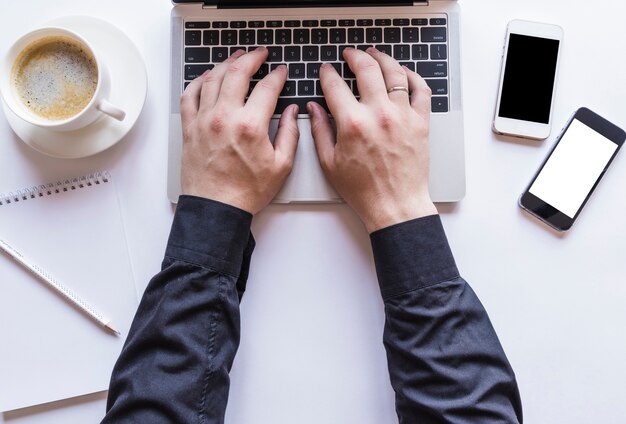 Boy working on grey laptop