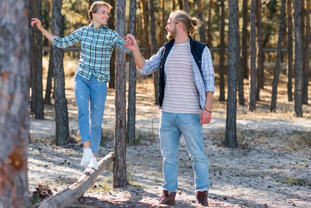 Boyfriend holding his girlfriend hand in the nature