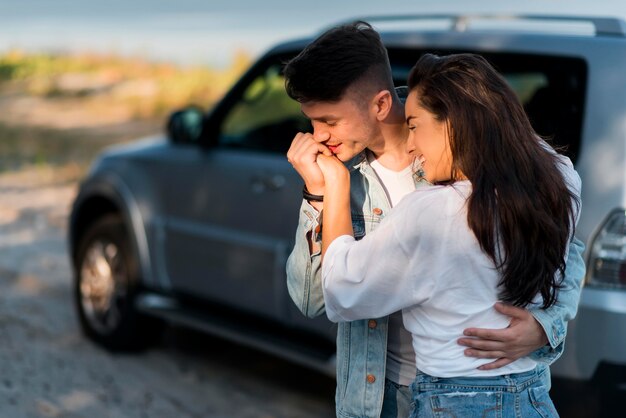 Boyfriend kissing his girlfriend hand medium shot