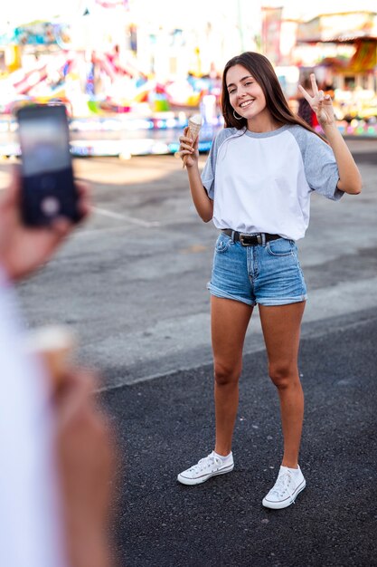 Boyfriend taking photo of girlfriend