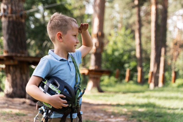 Free photo brave boy having fun at an adventure park