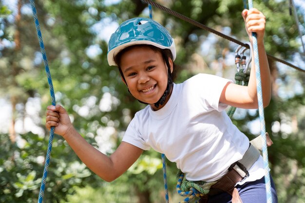 Brave girl having fun at an adventure park