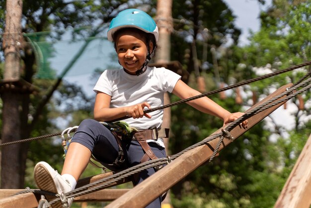 Brave girl having fun at an adventure park