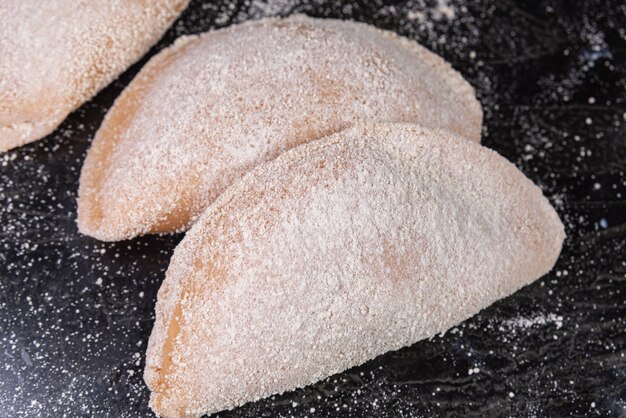 Brazilian chicken pastel on the table