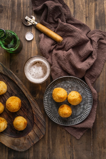 Free Photo brazilian food on plate and beer glass  top view