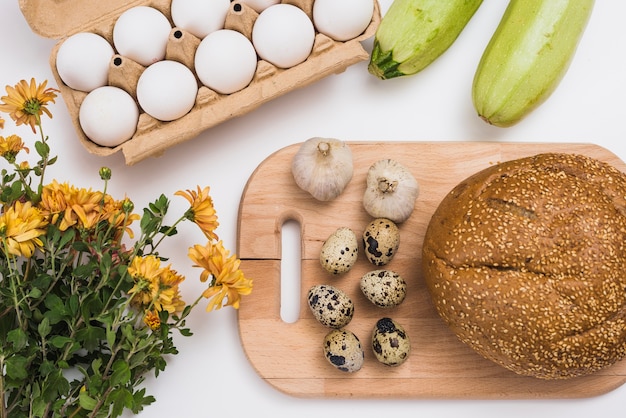 Free photo bread and eggs on wooden board