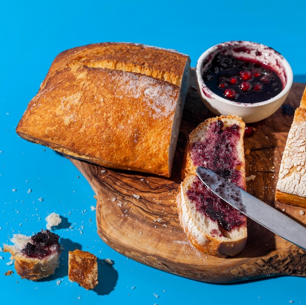 Bread and jam with leftover crumbs high view