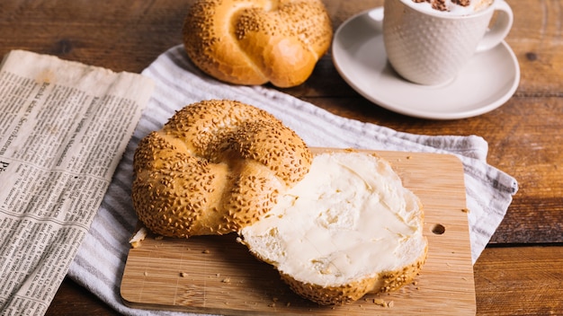 Free photo bread slice spread with cheese on table