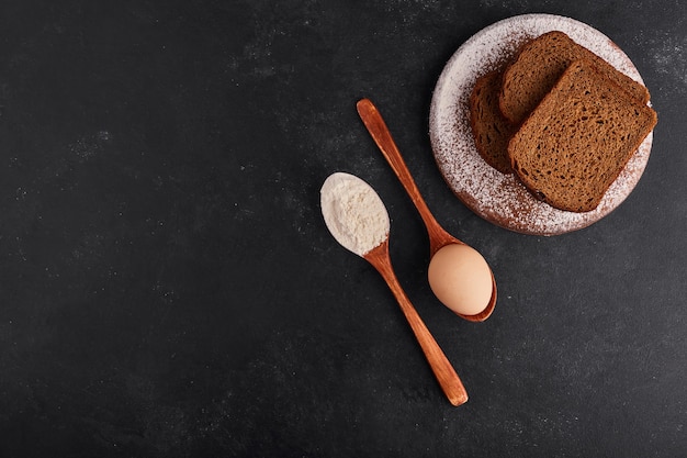 Free photo bread slices with ingredients, top view.