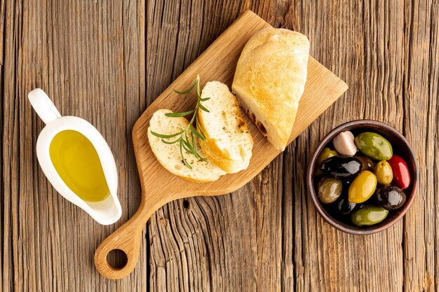 Bread slices with oil sauces and olives mix