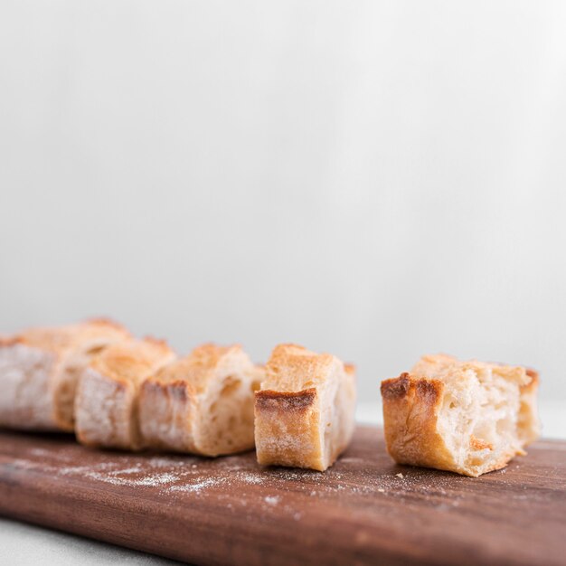 Bread slices on wooden board