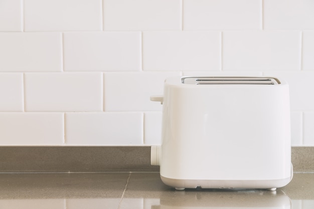 Free photo bread toaster at kitchen