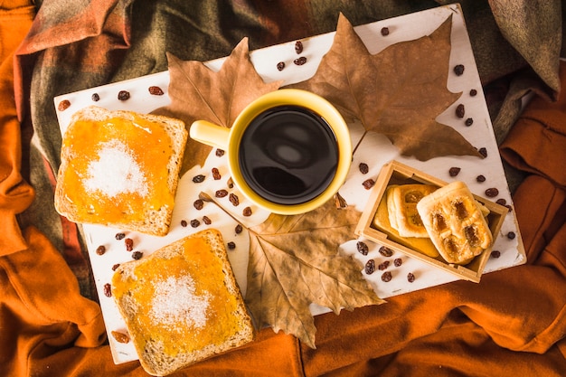 Breakfast food and leaves on fabric