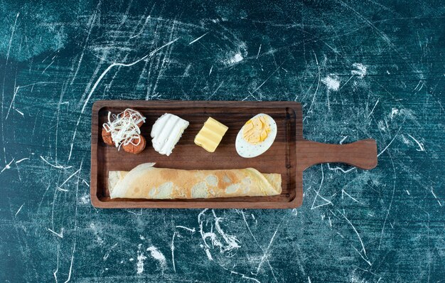 Breakfast platter with crepes and side ingredients. High quality photo