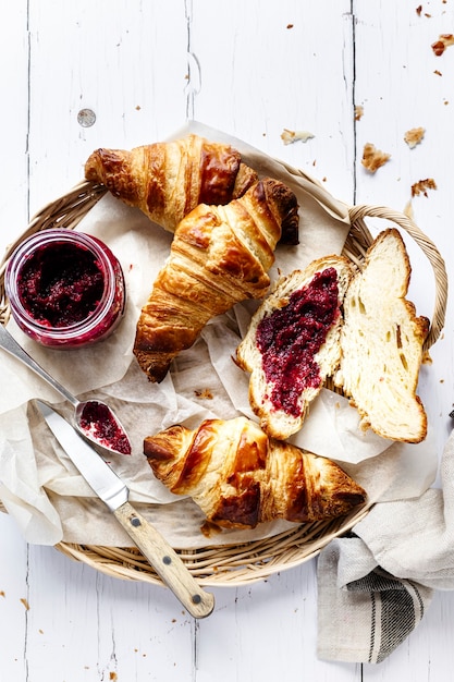 Free Photo breakfast set flat lay with croissant and raspberry jam food photography