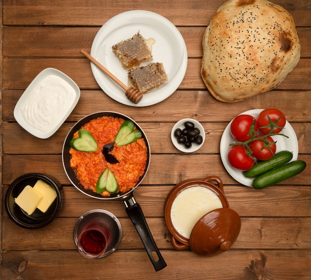 Breakfast set on wooden board top view