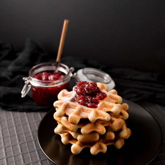 Free Photo breakfast waffles and raspberry jam