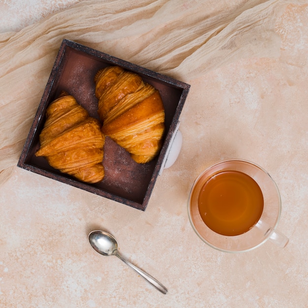 Free photo breakfast with croissant