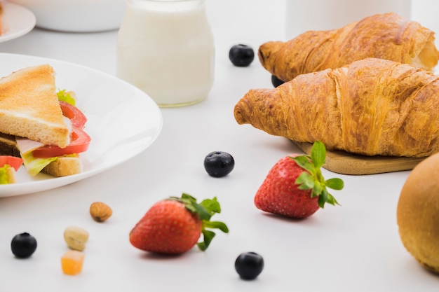 Breakfast with croissants and fruits